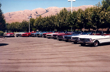 A dozen convertibles, being shot for Super Chevy.