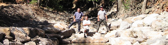 staff standing on boulders