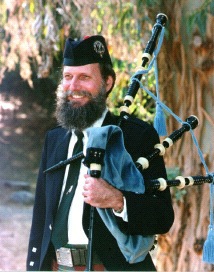 [John in kilt with Scottish bagpipes]