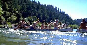 Four man canoe race at the Bohemian Grove.