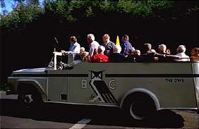 A shuttle bus enters the Bohemian Grove.