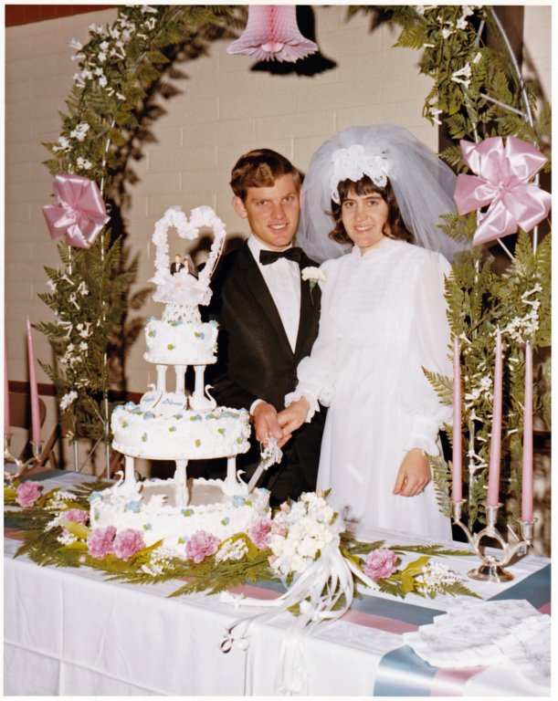 cuttingtheweddingcaketogether.jpg