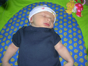 Damian_sleeping_on_his_activity_mat_6.9.07