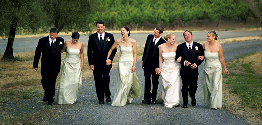 Wedding Party Holds up Bride Groom