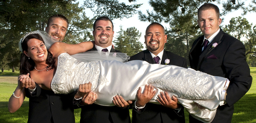 Wedding Party Holds up Bride Groom