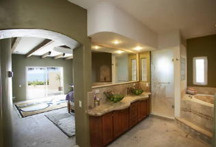 Master bath with oversized marble tub.