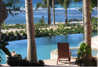 Lounge by the pool and enjoy the view of the Pacific Ocean.