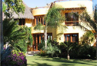 The Guest Residence with views of the lush tropical garden and Pacific Ocean.