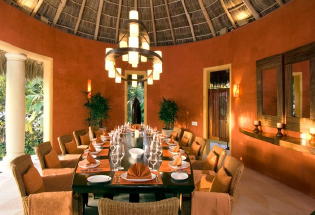 Formal dining room with views of the pool and ocean.