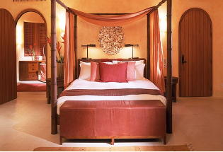 Master bedroom with king bed and views of the Pacific Ocean.