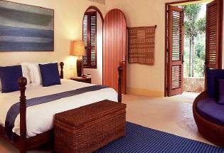 Guest bedroom with private terrace and view of the Pacific Ocean.