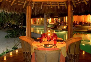 Private dining between pristine beach and pool.