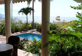 Tropical garden surrounding pool area