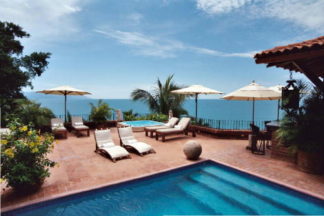 Looking from pool bedroom across poll and spacious terrace to view of Banderas Bay.