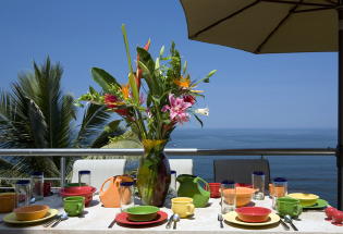 Outdoor dining with view of bay.