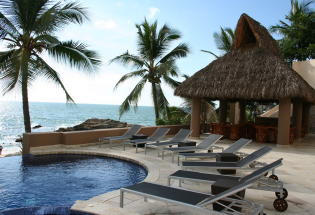 Looking North over pool terrace with Palapa covered sitting and outdoor eating area.