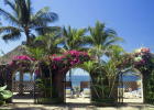 Beachfront terrace arches leading to beautiful white sand beach.