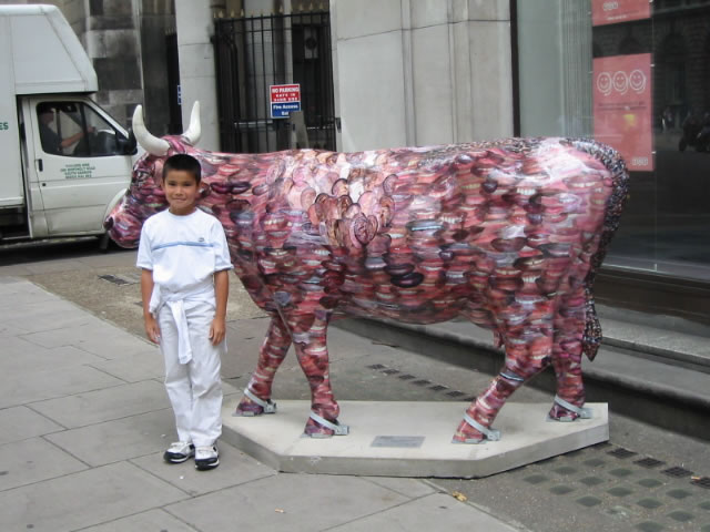 The face cow. It's hard to see, but the cow is decorated with mouths and eyes. Someone is watching you!